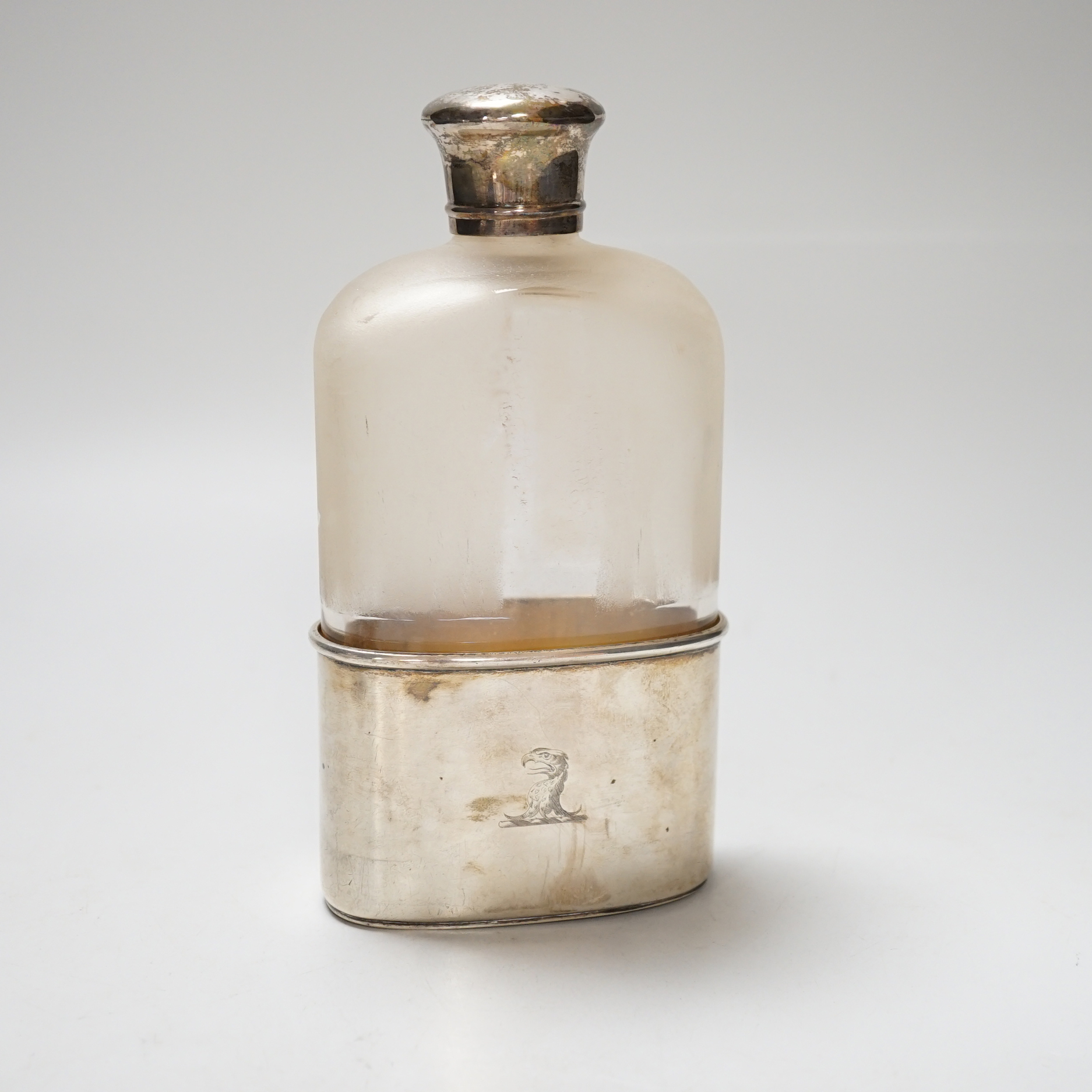 A Victorian silver mounted glass pocket flask, with crested cup base, London 1872, retailed by Asprey & Co., height 17.5cm